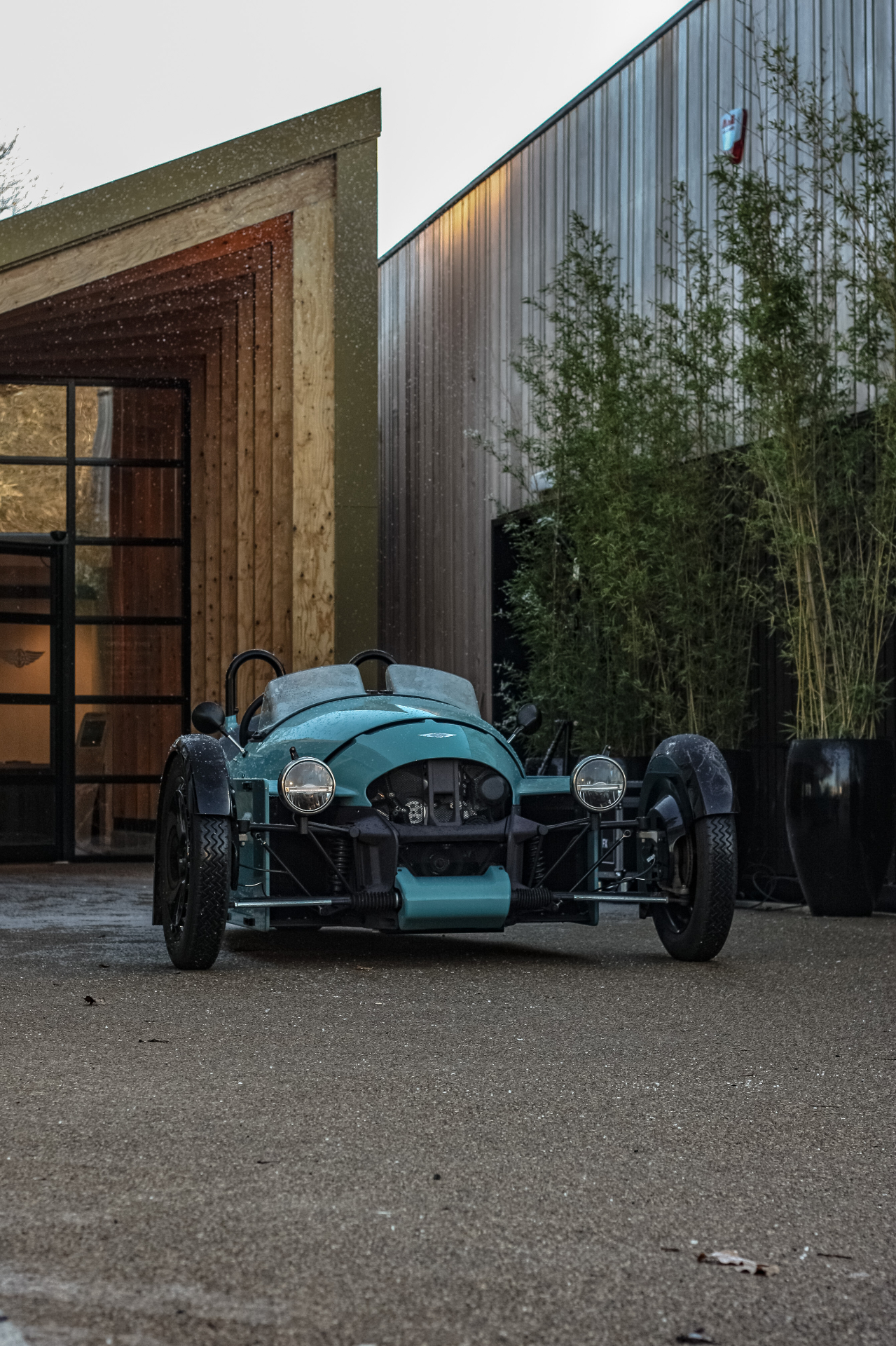 Morgan three-wheeler parked in a private garage